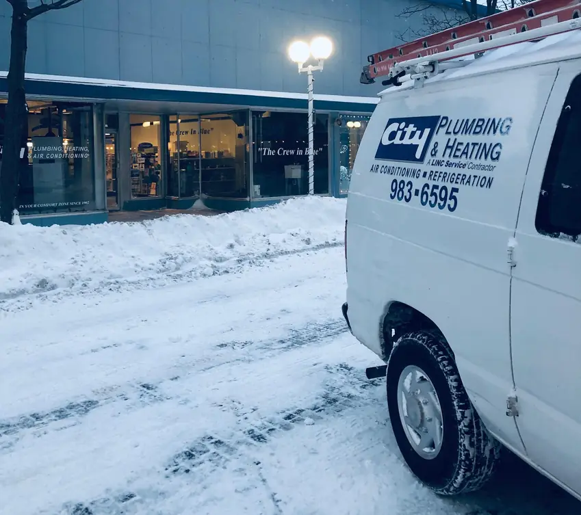 A City Plumbing van parked outside the 407 State Street storefront in downtown St. Joseph.